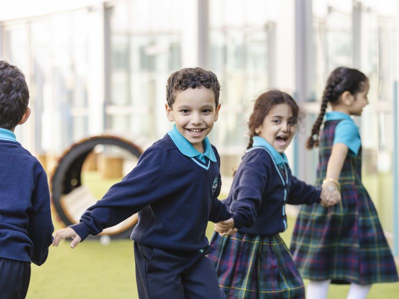 Children laughing together in the playground