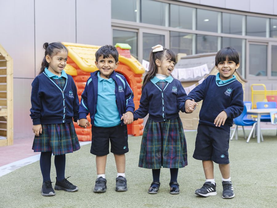 A group of Early Years pupils on the school field